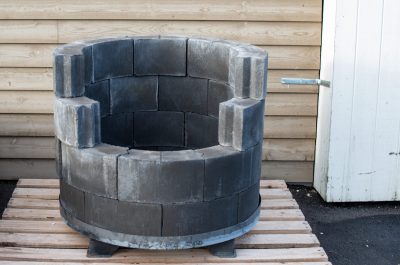 Grey,Circular,Porous,Backyard,Pavers,Stacked,To,Make,A,Homemade